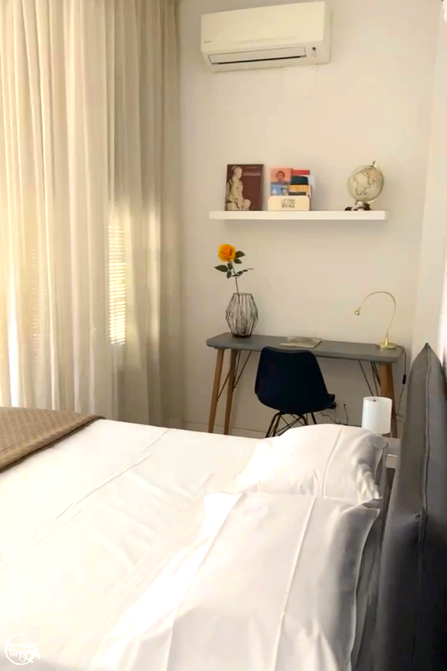 a bed and desk are shown in a Florence Italy apartment