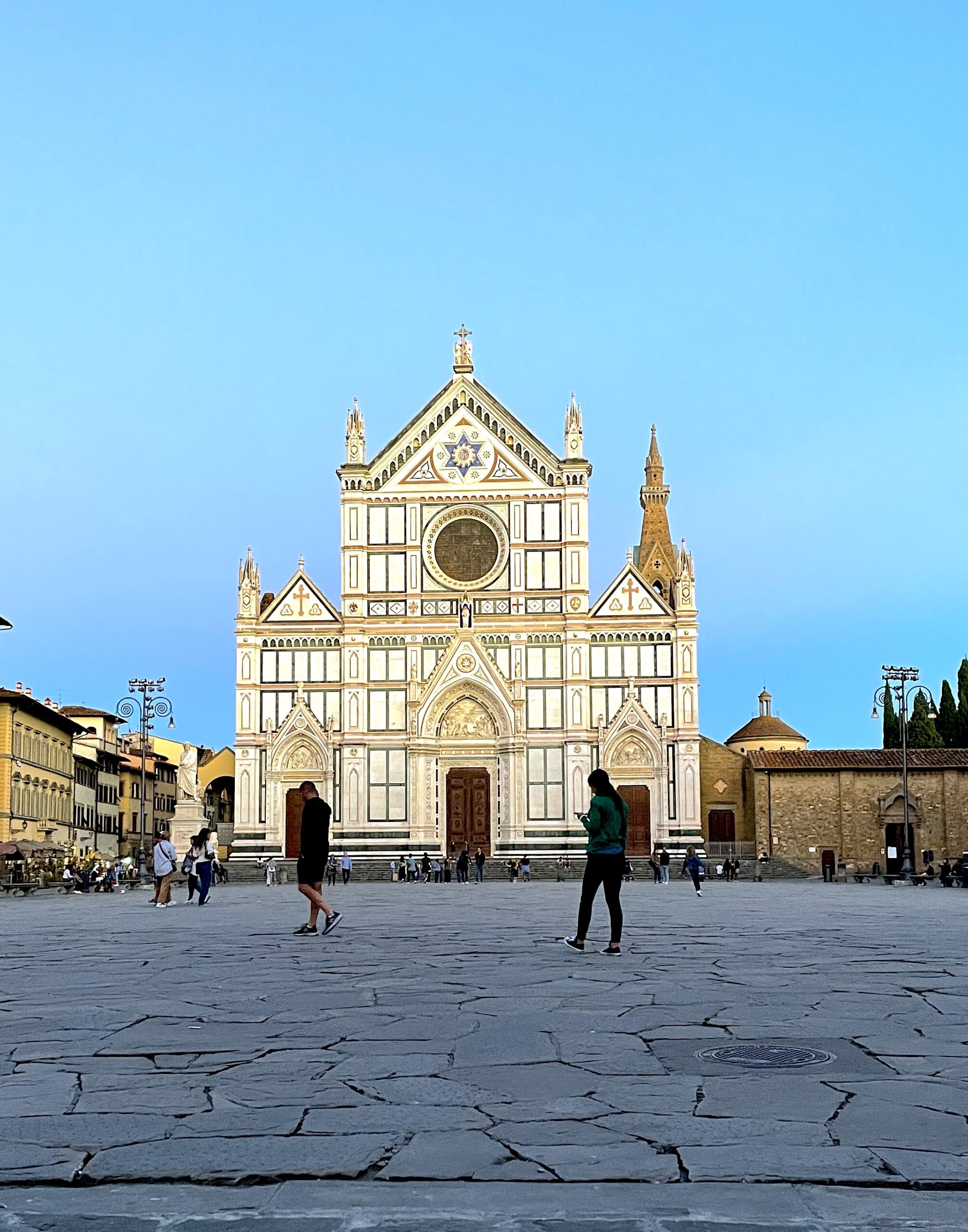 Santa Croce church is shown with the sun shining on it