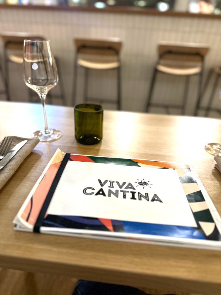 Villa Viva Hamburg 20 Dining table setup at Viva Cantina within Villa Viva Hotel in Hamburg with modern glassware and menu.