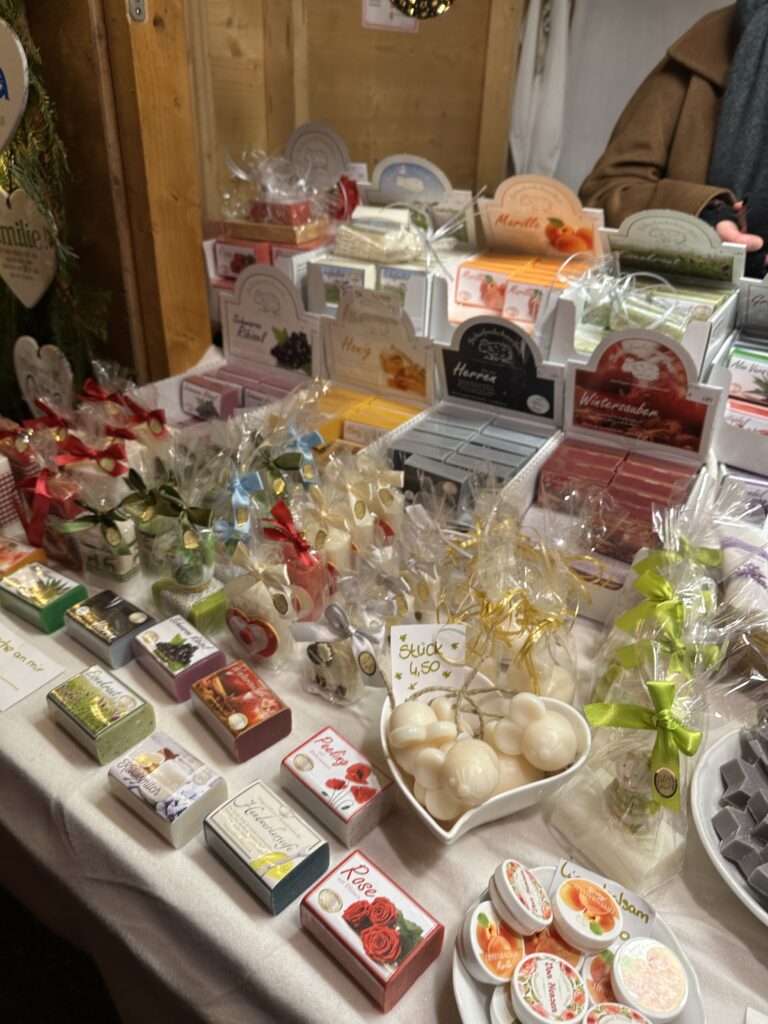 Ravenna Gorge Christmas Market 55 A colorful display of handmade soaps, wrapped gifts, and holiday trinkets at a vendor stall at the Ravenna Gorge Christmas Market.