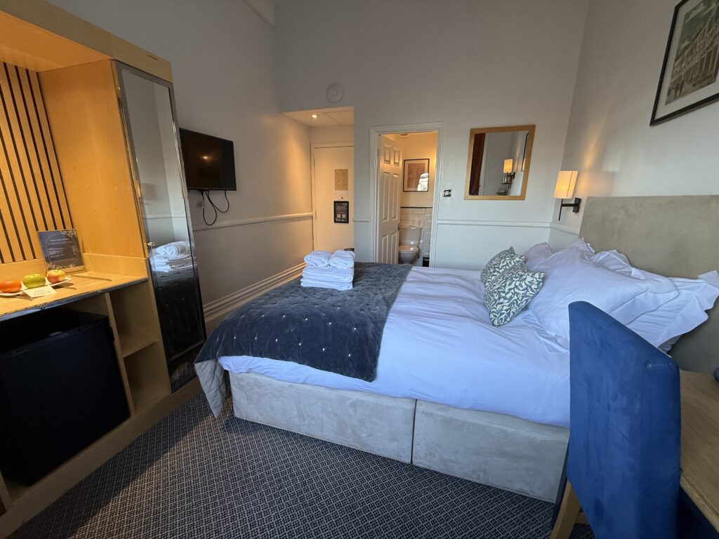IMG_8124 Guest room at The Rodney Hotel in Bristol featuring a double bed, modern decor, wall-mounted TV, and ensuite bathroom
