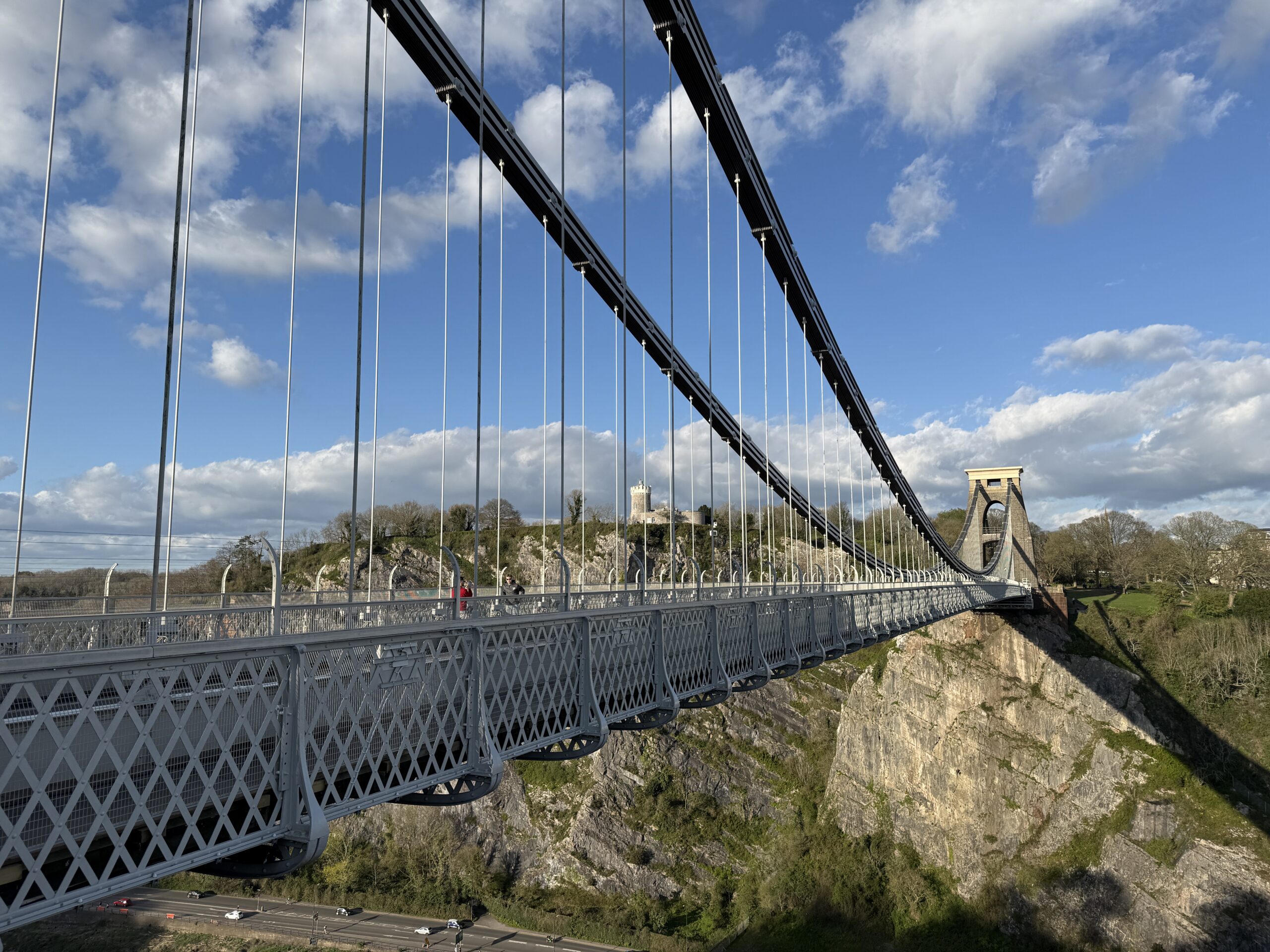 Clifton Suspension Bridge spanning Avon Gorge in Bristol under a blue sky with clouds